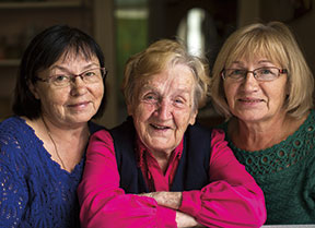 Photo of three smiling women. Link to Life Stage Gift Planner Over Age 70 Situations.
